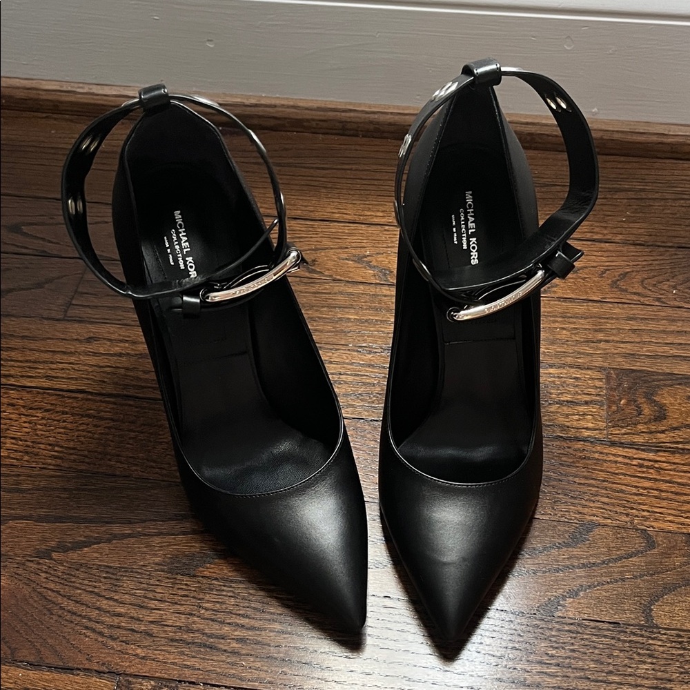 MK Black Pointed-Toe Ankle-Strap Pumps with Silver Hardware.